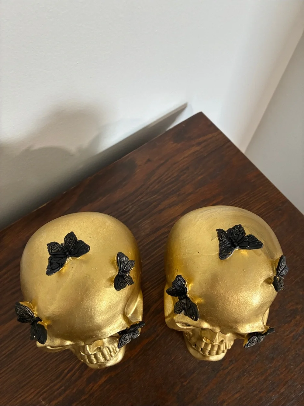 NWT- Set of 2- STUNNING- Gold Skull Statues with Black Butterflies Accents